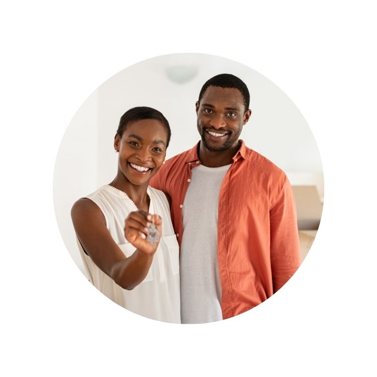 Young african american couple in white and orange clothing holding keys to first rental property