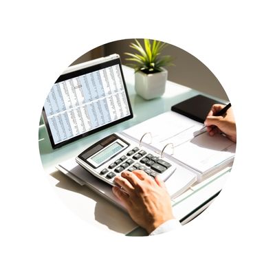desk view of someone working with spreadsheet, calculator and notebook