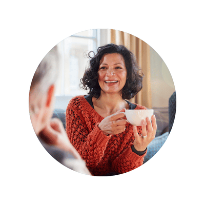 woman drinking coffee and having a conversation