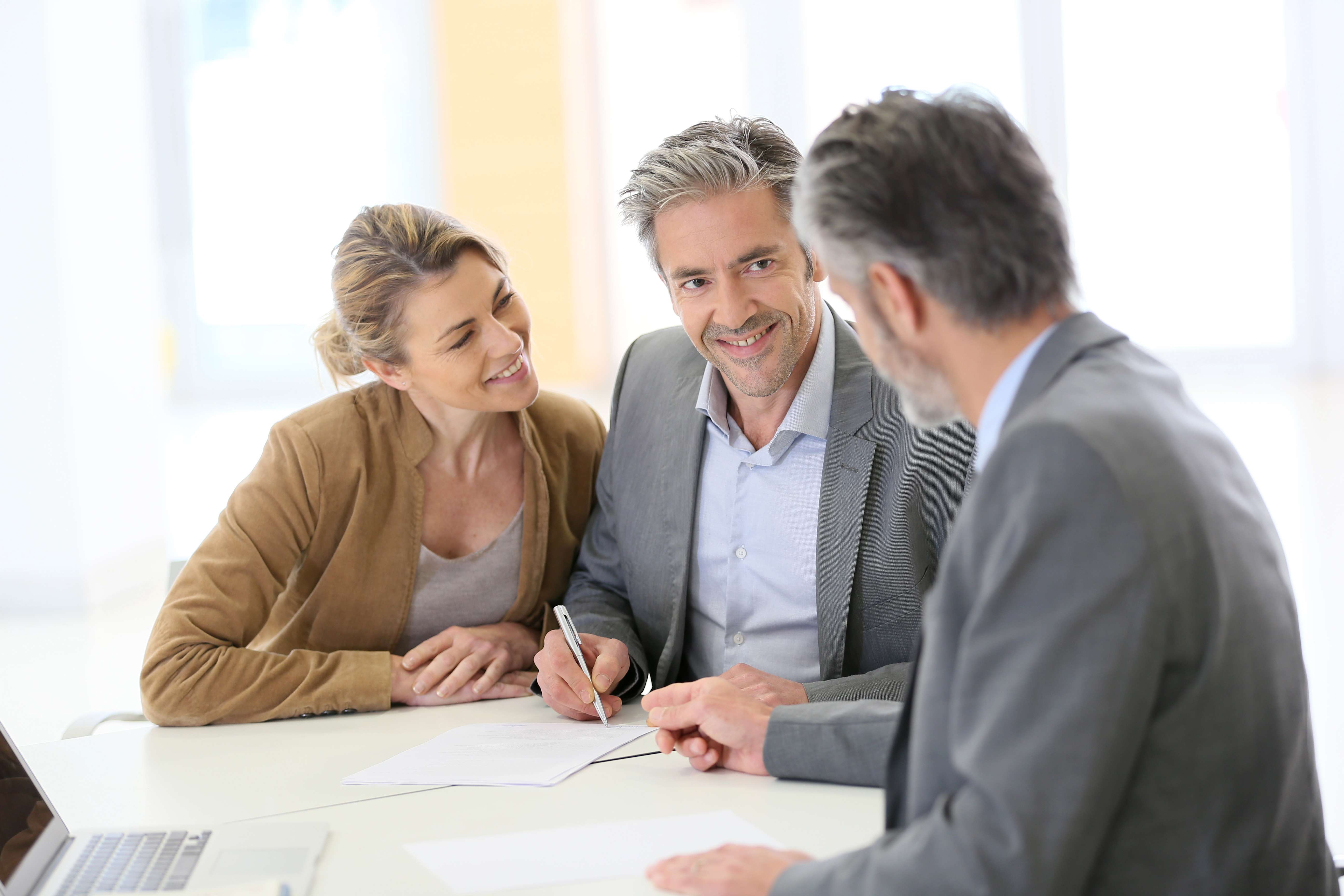Financial Advisor helping clients in a planning meeting